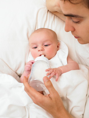 Dad Feeding Baby