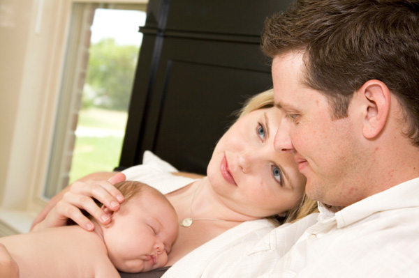 Couple with newborn baby