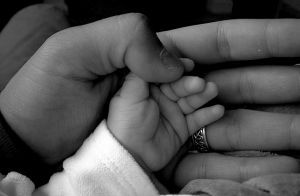 daughters_hand_in_mine.jpg